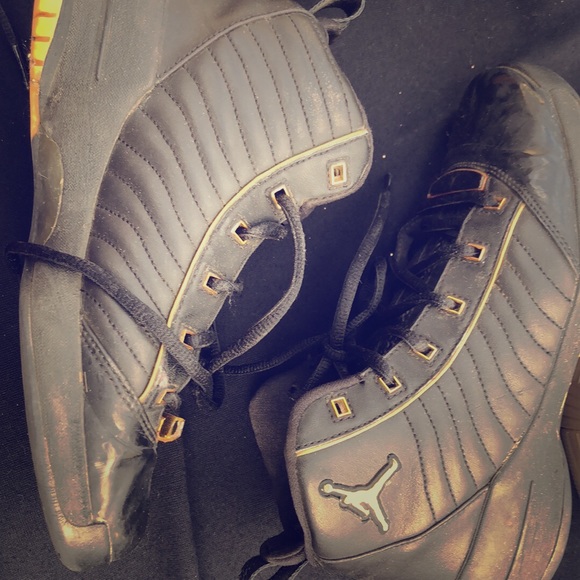 Black and gold Jordan 19s